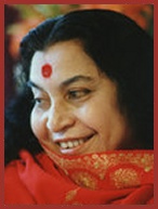 Shri Mataji Nirmala Devi smiling with red shawl