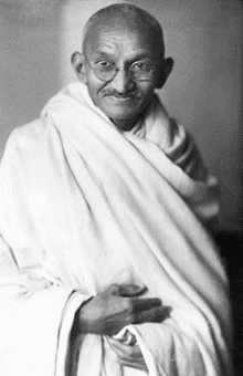 Mahatma Gandhi standing with white shawl