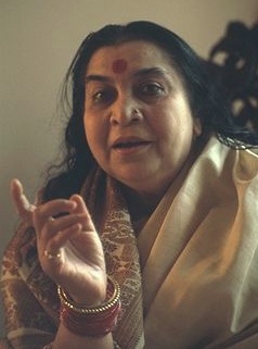 Shri Mataji Nirmala Devi speaking and showing right index finger