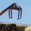 crane above materials in builders' merchant's yard