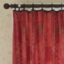 red curtain on wooden rail