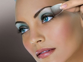 close up of model with makeup, eye shadow being applied