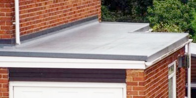sloping flat roof on domestic garage extension