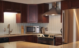 smart modern kitchen with natural wood cabinets